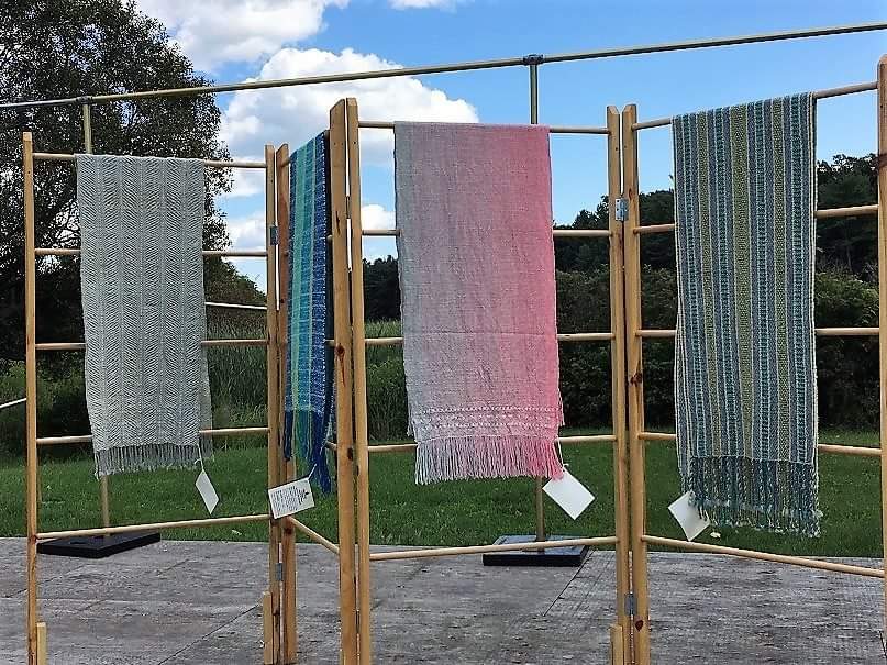 Weaving projects on display outside at Sheep to Shawl